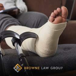 A personal injury victim in Goodyear, AZ sitting with their leg up in a cast 